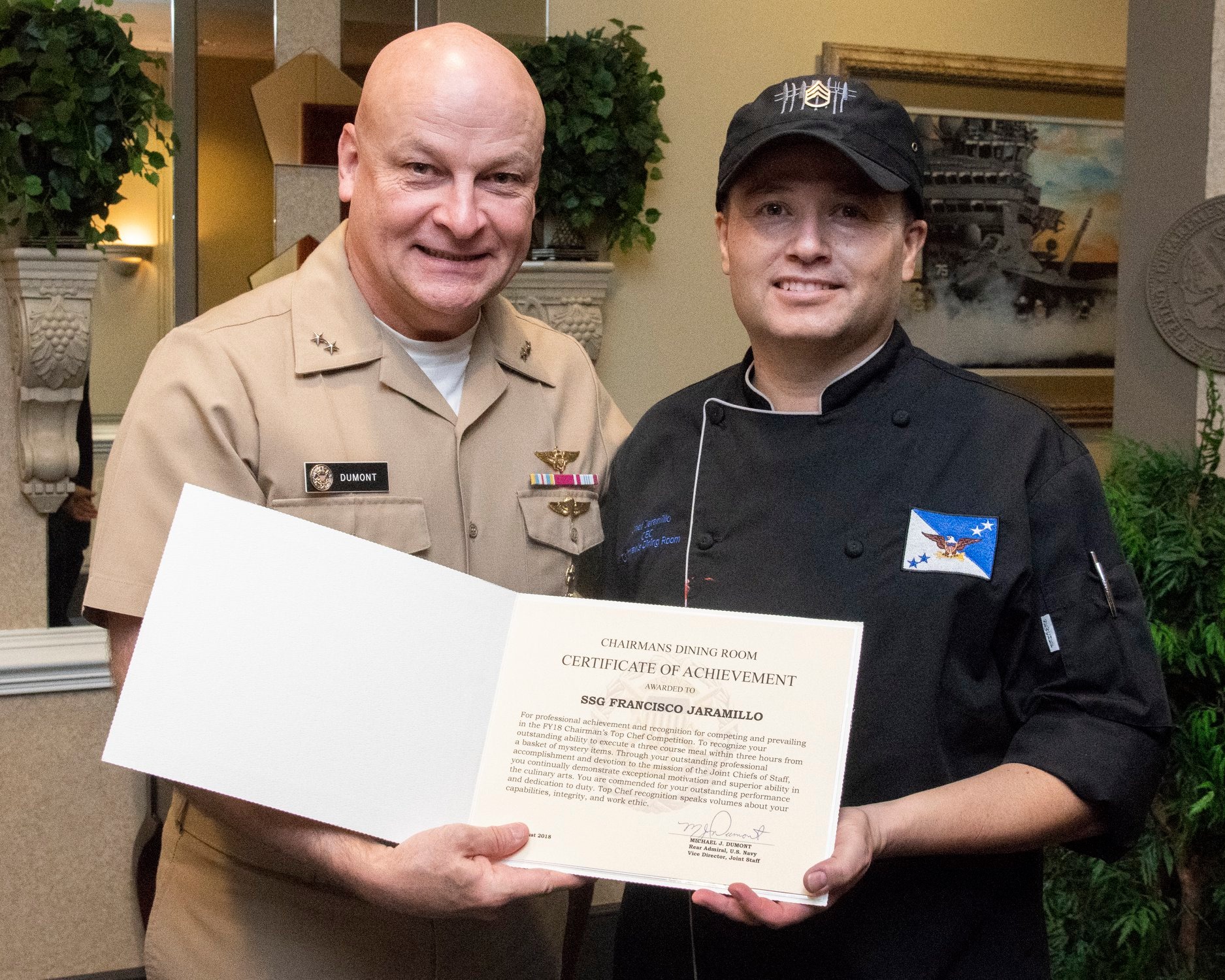 Chef J receiving Certificate of Achievement from Rear Admiral Michael J. Dumont